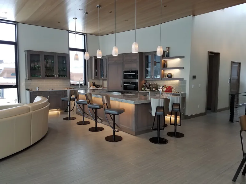 Modern open-plan kitchen and living space with pendant lighting in North Idaho