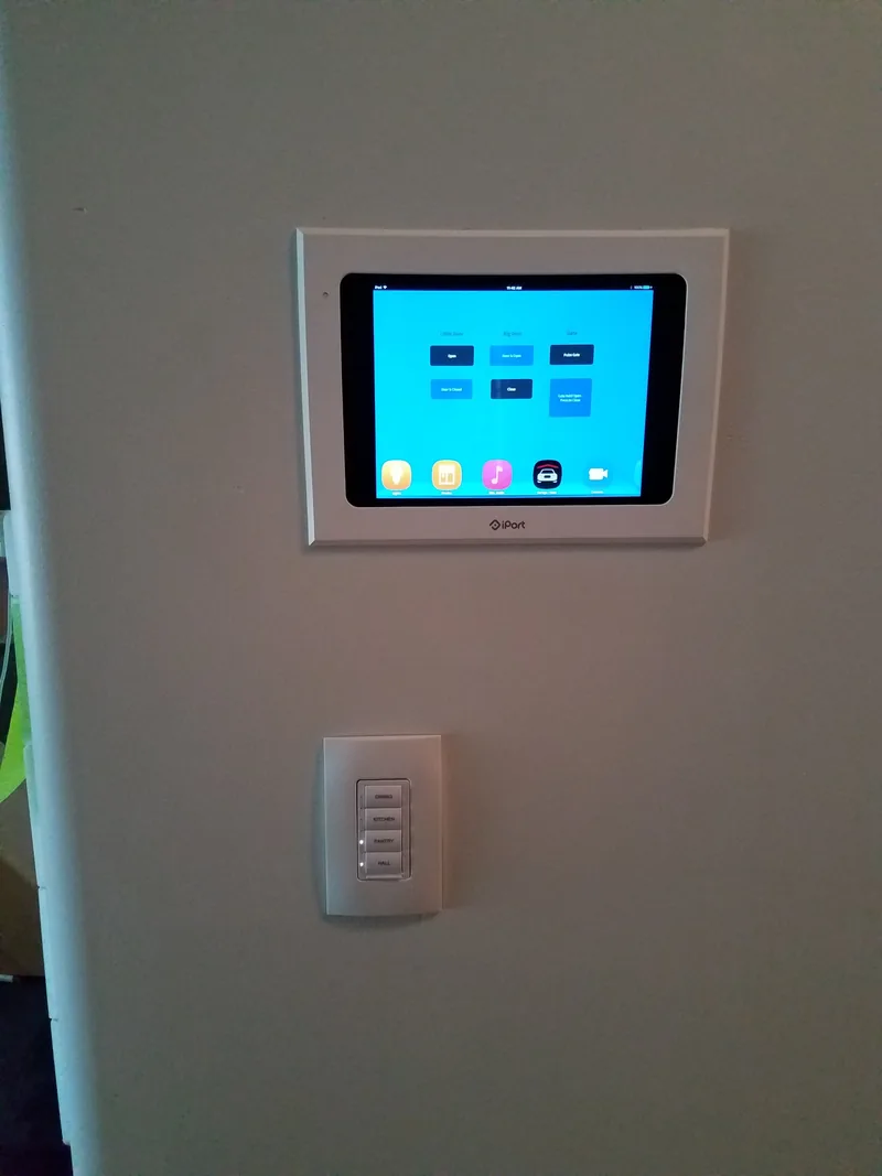 Wall-mounted smart home control touchscreen installed by Northwest Wattage
